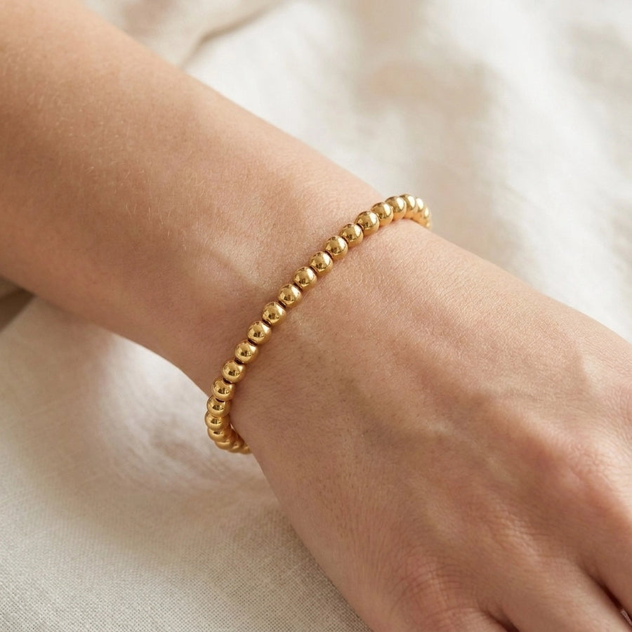 Everyday Dainty Gold Beaded Bracelet — worn light skin wrist