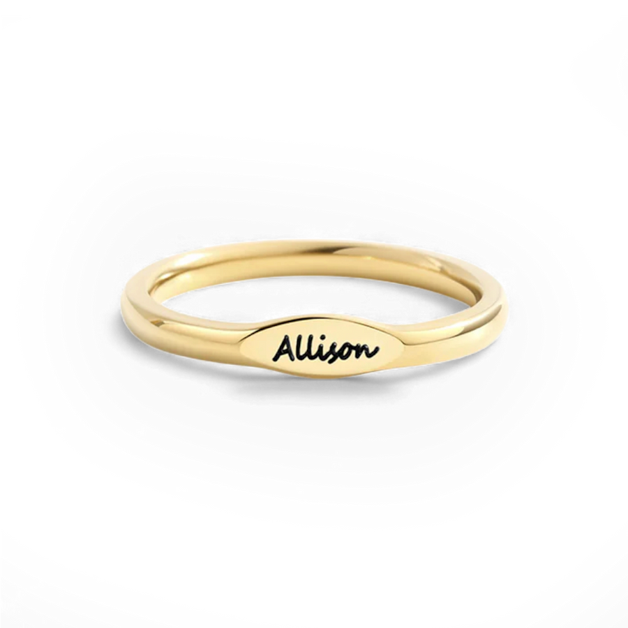 Skinny gold name ring engraved — closeup view