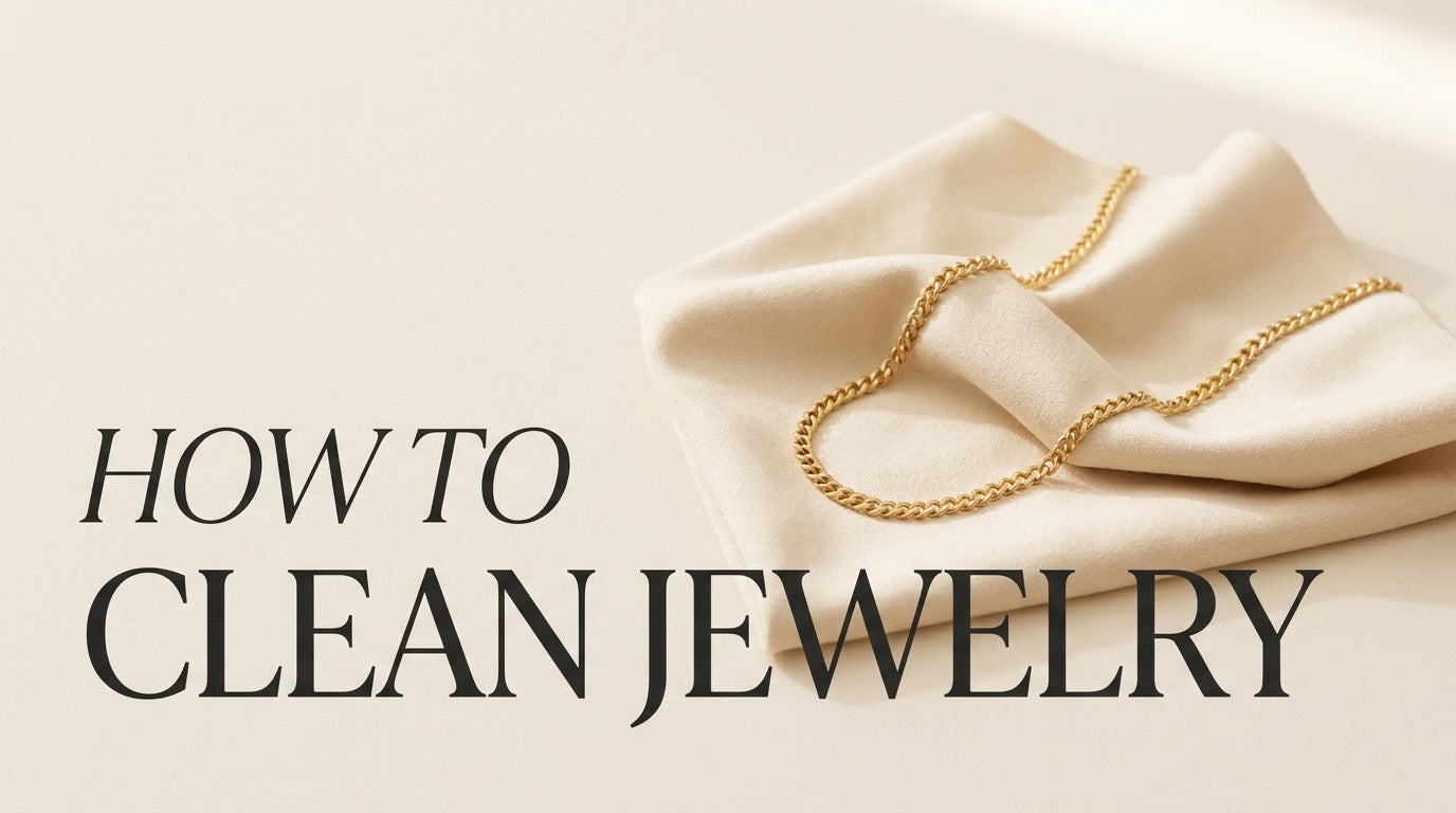 HEIRPEARL How to Clean Jewelry — calligraphic title overlay with delicate gold chain on cream cloth