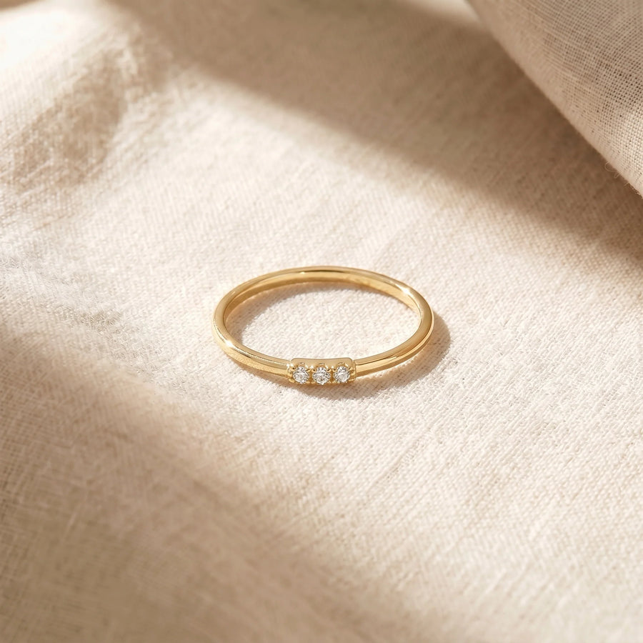 Dainty Diamonds Stacking Ring — flatlay on linen