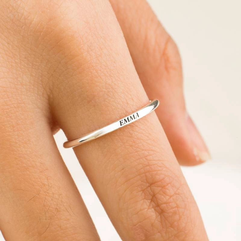 Flat-top stackable name ring worn on hand — 925 sterling silver lifestyle close-up