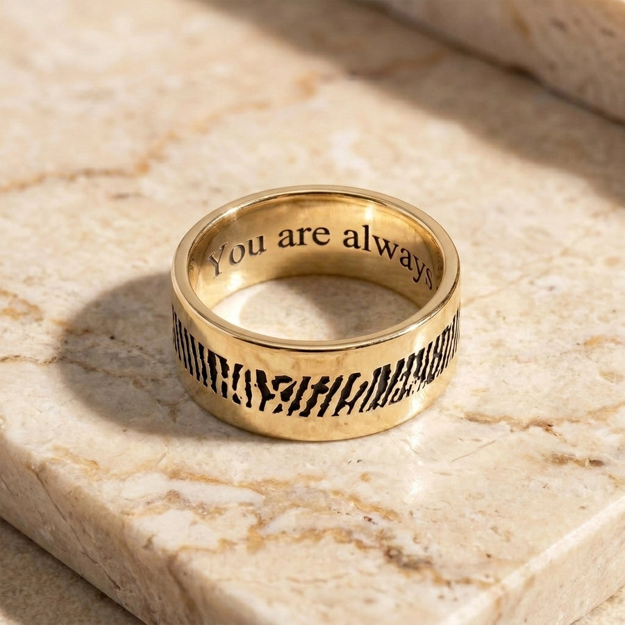 Men's Slender 14k Gold Fingerprint Ring on travertine marble flatlay