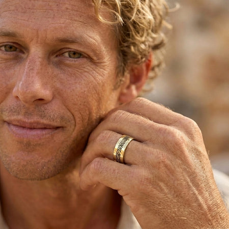 Men's Slender 14k Gold Fingerprint Ring worn close-up on Liam's hand