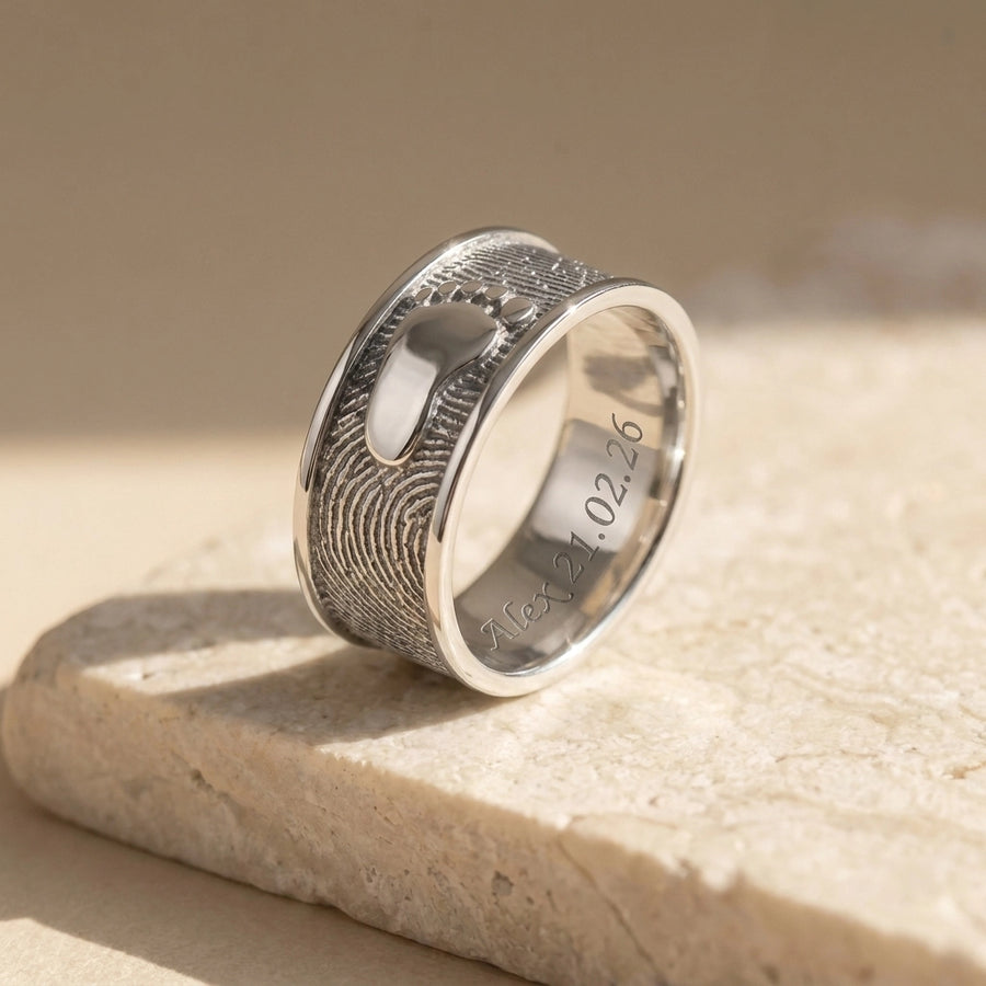 Ring Foot Print Sterling Silver Keepsakes on travertine marble surface, premium editorial photography